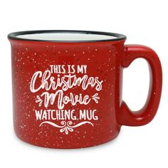 a red coffee mug with white lettering on the side and snowflakes around it