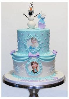 a frozen princess themed cake with snowmen on top