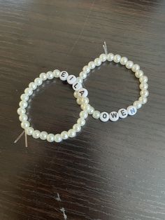 CUSTOMIZABLE White artificial pearl bead, stretchy bracelet with acrylic letters * Hand-made using artificial pearl beads, 4x7mm white round acrylic alphabet beads and 0.8mm elastic string * Beautifully packaged in a sheer white drawstring organza bag Choose any 14 alphabet characters or hearts (no spaces) Examples: names BFF FAITH BE🤍HAPPY DOG🤍MOM BEST🤍MOM BEST🤍TEACHER BE🤍YOURSELF I🤍AM🤍WORTHY KEEP🤍GOING COMPASSION I🤍CAN🤍DO🤍THIS Alphabet Beads Bracelet, Alphabet Characters, Beaded Braclets, Alphabet Beads, Acrylic Letters, Gelang Manik, I Am Worthy, Stretchy Bracelets, Best Teacher