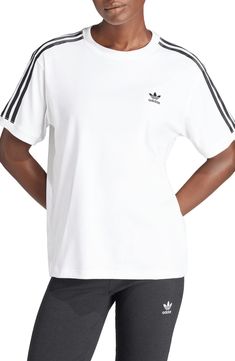 Heritage style meets modern comfort in this sporty T-shirt bearing classic 3-Stripes detailing and an embroidered Trefoil on the chest. Crewneck Short sleeves 94% cotton, 6% elastane Machine wash, line dry Imported Relaxed Fit Three Stripes T-shirt For Sports, Classic White T-shirt With Contrast Stripes, Adidas Relaxed Fit T-shirt With Three Stripes, Cotton T-shirt With Side Stripes, Adidas Sporty T-shirt With Contrast Stripes, Sporty Short Sleeve T-shirt With Side Stripes, White Relaxed Fit T-shirt With Contrast Stripes, Athleisure Crew Neck T-shirt With Contrast Stripes, Sporty White T-shirt With Signature Stripes