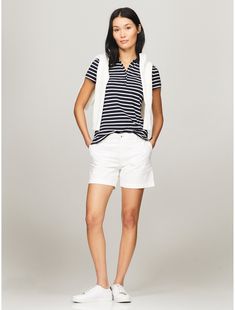 Tommy Hilfiger women's polo. Our classic stripe polo is a key part of the Hilfiger heritage—as relevant today as is was in 1985. This version is designed in a trim, flattering fit from comfortable stretch cotton.  Material: 97% Regenerative Cotton. Classic Tommy Hilfiger Striped Tops, Tommy Hilfiger Store, Kids Sale, Tommy Hilfiger Women, Cotton Polo, Stretch Cotton, Cotton Material, Womens Tees, Tommy Hilfiger