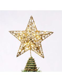 a lighted christmas tree topper with a star on it's head and lights in the shape of trees