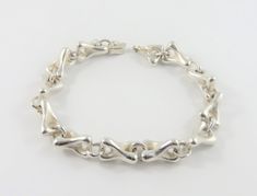 "This is a sterling silver  9 inch  gents bracelet. There are 12 links held together with large round jump rings. The bracelet has a high polished finish and has a slide- in style of clasp. The bracelet measures 9  inches in length  1/2\" wide The total weight is 80.19 grams. Marked: STER inside clasp Inventory #3152" Gents Bracelet, Jump Rings, Chain Link Bracelet, Jewelry Inspiration, Silver Bracelet, Jewelry Bracelets, Bracelet, Sterling Silver, Chain