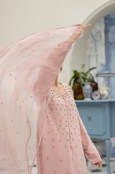 Meet our eye-catching Pale Pink pure crepe silk long shirt all hand worked with a spray of florets made with pearls, beads and sequins, a unique piece that stands out. It's versatile, comfy, and crafted with care. Perfect for making a bold yet elegant statement on any occasion. You can pair with matching pure organza dupatta handworked on the corners with resham motifs with spray of florets (Sold Separately). Silk Saree Dress, Astoria Ny, Misty Rose, Organza Dupatta, Saree Dress, Silk Pants, Long Shirt, Wedding Suits, Pale Pink