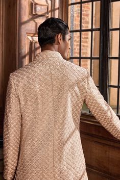 This set features all-over thread work highlighted with french knots and delicate sequin in a geometric pattern on a raw silk base. The ensemble is paired with a matching silk kurta and an afghani salwar.From Seema Gujral's A Royal Affair collection. DELIVERY TIMEPlease allow 8-12 weeks for your outfit to arrive. FABRIC DETAILSSherwani- Raw SilkKurta - SilkAfghani Salwar -Silk Professional cleaning only. Elegant Silk Sherwani With Resham Embroidery, Silk Sherwani With Embroidery For Reception, Bollywood Style Suits With Resham Embroidery For Eid, Unstitched Chikankari Embroidery Suit For Festive Occasions, Fitted Lawn Suit With Intricate Embroidery For Reception, Elegant Long Sleeve Lawn Suit For Reception, Designer Silk Bandhgala With Resham Embroidery, Silk Bandhgala With Resham Embroidery For Designer Wear, Transitional Silk Sherwani With Dabka Work