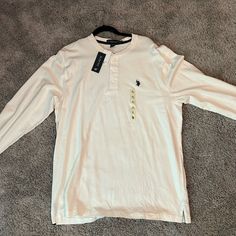 Upgrade Your Wardrobe With This Classic Ralph Lauren Long Sleeve Polo Shirt. Made From A Soft, Breathable Cotton Blend, It Offers Comfort And Style For Any Occasion. The Simple Design And Iconic Logo Make It Versatile For Casual Or Dressier Events. In Excellent Condition With No Signs Of Wear. Perfect Addition To Your Wardrobe! Classic Ralph Lauren, Ralph Lauren Long Sleeve, Iconic Logo, Lauren White, Long Sleeve Polo Shirt, Long Sleeve Polo, Ralph Lauren Shirt, Ralph Lauren Men, Casual Shirts For Men