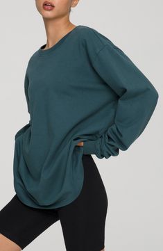 Let yourself lounge in the soft comfort of this oversized long-sleeve T-shirt with slouchy dropped shoulders and cut from breathable cotton. Crewneck Long sleeves 100% cotton Machine wash, tumble dry Imported Women's Clothing Black Owned and Founded Relaxed Fit T-shirt With Ribbed Cuffs For Fall, Oversized T-shirt With Ribbed Cuffs For Loungewear, Basic Long Sleeve T-shirt For Loungewear, Oversized T-shirt For Fall, Slouchy Drop Shoulder Tops For Loungewear, Oversized Relaxed Tops For Loungewear, Relaxed Oversized Tops For Loungewear, Green Long Sleeve Activewear For Fall, Fall T-shirt With Ribbed Cuffs And Relaxed Fit