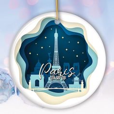 a christmas ornament with the eiffel tower in paris