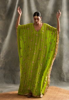 Editor's Note Pure Crepe Floor Length Kaftan With Handmade Lampi Triangles Embroidered All Over As Well As Edged At The Border Fabric: Crepe Color: Olive Green Care: Dry Clean Only About the Designer Itrh makes a high-end luxury Indian ethnic wear made using exquisite and endangered age-old crafts such as kalamkari, madhubani, chikankari, zardozi, and gota weaving. The focus of the house is to cherish the beauty of handcrafted luxury designer wear. Green Kaftan, Kaftan For Women, Kaftan Designs, Parrot Green, Islamic Dress, فستان سهرة, Stylish Dress Book, Embroidered Clothes, Desi Fashion