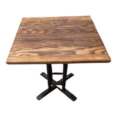 a wooden table with two black legs and a square shaped top on an isolated white background