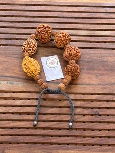 This is a divine bracelet made from natural auspicious beads of 2 - 7 mukhi Rudraksha in black adjustable chord.  This bracelet is adjustable so can fit any wrist size.  This is a healing Shiva bracelet, blessed by priest. The benefits of  2 Mukhi Rudraksha signifies the unity of SHIVA and SHAKTI    We wish you happy wearing and chanting Shiva And Shakti, Rudraksha Bracelet, Wrist Band, Band Bracelet, Bracelet For Men, Shiva, Arm Band, Bracelet Making, Bracelets For Men