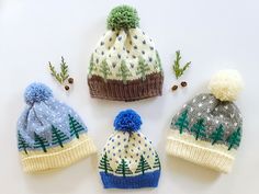 four knitted hats with different colors and designs on the top one is blue, grey, white and green