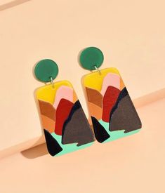 A very light weight and vibrant trapezoid drop Earrings, perfect for any season. They will complement any outfit and the color block detail is beautiful Color Block Accessories, Bold Geometric Earrings With Bold Design, Bold Geometric Designed Earrings, Trendy Geometric Green Jewelry, Trendy Green Geometric Jewelry, Bold Geometric Earrings, Artsy Multicolor Rectangular Earrings, Modern Green Geometric Earrings, Multicolor Rectangular Earrings For Party