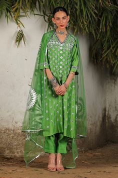 Green chanderi kurta with floral hand embroidery. Comes with straight pant and a dupatta. - Aza Fashions Pista Green Straight Kurta Sets With Mirror Work, Pista Green Sets With Mirror Work And Straight Kurta, Traditional Chanderi Sets With Gota Work, Chanderi Sets With Gota Work In Traditional Drape, Green Dola Silk Palazzo Set With Mirror Work, Pista Green Chikankari Embroidery Palazzo Set In Slub Silk, Chanderi Palazzo Set With Chikankari Embroidery For Navratri, Festival Slub Silk Churidar With Mirror Work, Festivals Slub Silk Churidar With Mirror Work