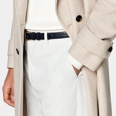 Mid-thigh length overcoat in sand, featuring wide peak lapels and natural shoulders. Double-breasted closure, patch pockets, and inside pockets for functionality. Single vent, lined, with martingale belt for style. Timeless Belted Long Sleeve Outerwear, Timeless Outerwear With Belted Cuffs, Classic Outerwear With Notch Lapel And Belted Cuffs, Elegant Outerwear With Suit Collar And Belt Loops, Elegant Outerwear With Belt Loops And Suit Collar, Elegant Long Coat With Belt Loops, Elegant Belted Outerwear For Semi-formal Occasions, Business Outerwear With Belted Cuffs In Gabardine, Elegant Cream Wool Coat For Business