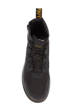 The label's Original boot gets reimagined for contemporary utility in a hybrid construction of lightweight Ajax leather and Extra Tough 50/50 fabric.The cemented Tarian lug sole is finished with DM's iconic yellow topstitching. 2" platform, 6" shaft (size 9) Lace-up style; side zip closure Textile and leather upper/leather lining/synthetic sole Imported Slip-resistant Leather Combat Boots For Streetwear, Streetwear High Ankle Lace-up Boots With Reinforced Toe, Slip-resistant Synthetic Waterproof Boots For Streetwear, Black Weatherproof Lace-up Boots For Outdoor, Black Slip-resistant Waterproof Boots For Streetwear, Black High Ankle Lace-up Boots For Outdoor, Urban Ankle-high Outdoor Boots, Urban Ankle-high Boots For Outdoor, Functional Lace-up Combat Boots For Streetwear