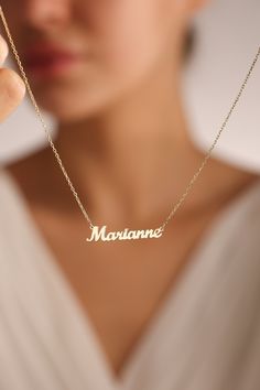 "14k solid gold name necklaces are great personalized gift ideas for special people. You can personalize this gold name necklace and silver name necklace with your own meaningful message. This stunning piece of custom name necklace allows you to customize with different colors. Everyone loves personalized Jewelry and this name jewelry will be your favorite necklace.   💖 Personalized Name Necklaces are one of the most loved designs by our customers. 🎁Great Dainty necklace as mother necklace, Christmas Gift, birthday gift, mothers day gifts, Gifts for mom ✋All our jewelry is %100 custom made by hand with Love and Care in our workshop! Nickel Free High Quality Materials Standard Deliver in 8-12 Business Days Name size - lowercase letters are approximately 4 mm and uppercase letters are appr Gold Necklaces With Name, Customizable Gold Necklaces For Personalized Gifts, Customized Dainty Nameplate Necklace, Customizable Gold Necklace For Personalized Gift, Personalized Gold Custom Name Necklace, Customizable Nameplate Necklace For Personalized Gift, Gold Initial Pendant Name Necklace For Mother's Day, Gold Nameplate Necklace With Custom Text, Dainty Nameplate Necklace Customizable