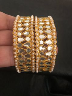 It's time you level up your jewelry box! Add in some bling to with our royal handmade kundan bangles! Style with love and care! We put in so much effort in what we do,because we do it for YOU❤️ Made to order and shipping time 4-6 weeks Can be make as a pair or single too. Each bangle price : $20 Elegant Bangle For Navratri Gift, Diwali Gift Toe Ring Jewelry, Elegant Bangle For Navratri, Diwali Toe Ring With Stone Work, Bollywood Style Festive Jewelry For Diwali, Intricate Bangle Jewelry For Diwali, Traditional Bangle Jewelry For Navratri, Bangle Bracelets As Diwali Gifts, Navratri Intricate Bangle Jewelry