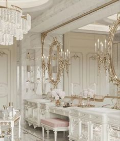 an elegant bathroom with chandeliers and mirrors