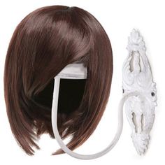 a wig and hair clip are shown on a white headband with long brown hair