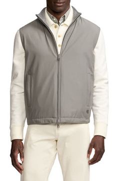 Lightweight and reversible, this vest doubles up on luxe sophistication with a wool-and-cotton glen plaid–jacquard side and a solid-hue mulberrry silk reverse. Two-way front-zip closure Stand collar Vertical side-zip pockets; side welt pockets (reverse) Drawcord-toggle hem Reversible 65% wool, 35% cotton with 100% silk reverse Dry clean Made in Italy Designer Clothing Classic Sleeveless Cotton Outerwear, Classic Winter Layering Vest, Classic Winter Vest For Layering, Classic Layering Vest For Winter, Silk Vest, Glen Plaid, Purple Label, Outerwear Vest, Ralph Lauren Purple Label