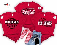 three red shirts with greyhound volleyball on the front and two blue shorts, one white