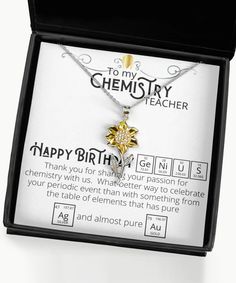 a box with a necklace in it that says happy birthday to my chemistry teacher on the front