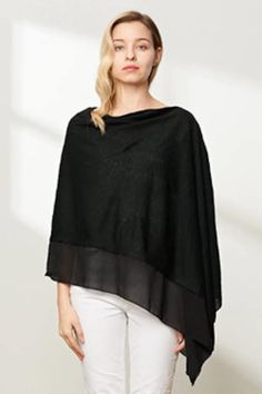 Gorgeous Bonded Knit Poncho, Shawl,  chic and  great quality! Great for the Office,  wear as a outdoor Fall shawl! In Black, Beige or Cool Grey! Like a piece  of jewelry a great buy to wear with everything you can imagine, leggings, jeans, shorts or dress.  Wool Mix (knit stretch ) Light Poncho can be worn two ways, asymetric as photo side seam along  the shoulder to hem or with the center back seam going down the back. Wool Mix 80% Acrylic 20% Wool Machine Washable Gentle Cycle or Hand Wash Col Black Bohemian Poncho With Batwing Sleeves, Bohemian Shawl For Fall Layering, Black Batwing Sleeve Poncho For Spring, Bohemian Black Poncho For Fall, Shawl For Layering, Black Shawl Wrap For Fall, Bohemian Shawl For Layering, Black Bohemian Shawl For Fall, Black Shawl For Fall