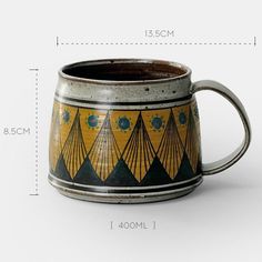 an old coffee mug is shown with measurements