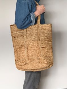 A Handmade Boho Straw Shopper bag perfect for everyday use, ideal for summer days and the beach. These bags are made from 100% natural Jute fiber .  These are carefully woven, with expertise from the interior parts of India. The beauty of these handmade baskets is in their naturality and in the man made follies that come along these. These bags being made from natural fibers are Eco friendly. Every penny invested in this piece of art contributes to the livelihood of some artisan families.Large c Summer Bags Beach, Large Shopper Bag, Woven Beach Bags, Black And White Cushions, Modern Cushions, Straw Beach Bag, Handmade Baskets, Straw Bags, Jute Bags