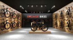 a bike shop with bikes on display in the wall and wooden shelves behind it that says engage bikes