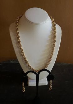 Fine quality necklace and matching earring jewelry set. Shiny chunky gold metal rope chain necklace with matching pierced rope chain drop earrings with push closure. statement pieces are very on trend! Jewelry box included Measurements provided in photographs circa 1980s For more fabulous finds Please visit our boutique https://www.etsy.com/shop/chicvintageclassics?ref=hdr_shop_menu Vintage Gold Jewelry With Rope Chain, Vintage Gold Rope Chain Jewelry, Trend Jewelry, Rope Chain Necklace, Earring Jewelry, Chain Ring, Rope Chain, Jewelry Trends, Chain Styles