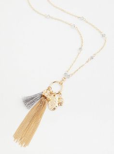 Bump up the flirt and flair in your outfits with this gold-tone charm tassel necklace. 30” length + 3” extender. Lobster clasp. Man-made materials. Imported. The best plus size women's gold-tone charm tassel necklace necklaces in gold. Torrid is your destination for the freshest spring and summer styles. Gold Long Tassel Necklace With Adjustable Fit, Gold Metal Dangle Tassel Necklace, Gold Metal Tassel Dangle Necklace, Gold Tassel Dangle Necklace, Gold Lariat Tassel Necklace, Gold Tassel Lariat Necklace, Gold Tassel Necklace With Adjustable Chain, Chic Gold Tassel Necklace For Gifts, Bird Beads