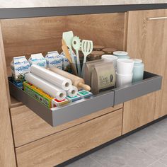 an organized kitchen drawer with utensils and baking supplies