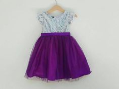 Silver and purple flower girl dress. The top is silver sequin with short sleeve and the bottom is purple glittered tutu with matching satin ribbon belt.Perfect for flower girl dresses in purple wedding theme.The tutu used here is purple number 45I also can do another color as in the last picture, just leave me a note at the 'message to seller' box when check out or do not hesitate to contact me to inquiry.Custom Order Size: Please provide your child measurement: Chest and specific length otherwi Purple Tulle Skirt, Purple Tutu Dress, Purple Flower Girls, Purple Flower Girl Dress, Purple Girls Dress, Flower Girls Dress, Purple Tutu, Purple Wedding Theme, Silver Sequin Dress