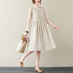 "★★FEATURES * 100% Linen * Two side pockets * Pullover dress * Scoop neckline * Sleeveless linen smock dress * Volume dress * Waist pleated details * Knee length * Suit for summer vacation, beach, home etc. * Perfect for summer, spring * Wash by hand or machine in cold water * The model is 165cm (5′ 5″) tall with a 80 cm (31.5\") bust, 66 cm (26\") waist. She is wearing a dress in size XS. ★★ Bespoke Order Service If you Request other color Request the length Your height is not between 155 cm- 1 Short Linen Dress, Volume Dress, Suit For Summer, Beige Shorts, Dress Beige, Dress Linen, Vacation Beach, Smock Dress, Dress With Pockets