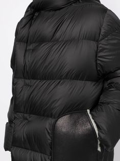 hooded padded coat from Rick Owens featuring black, padded design, concealed front fastening, slip pockets to the sides, long sleeves and straight hem. | Rick Owens Hooded Padded Coat Luxury Parka With Faux Fur Trim, Designer Quilted Hooded Puffer Jacket, Luxury Outerwear With Faux Fur Trim And Down Material, Luxury Down Puffer Jacket With Detachable Hood, Black Hooded Quilted Parka, Black Quilted Hooded Parka, Black Luxury Puffer Jacket With Double-lined Hood, Luxury Black Puffer Jacket With Double-lined Hood, Classic Black Winter Puffer Jacket