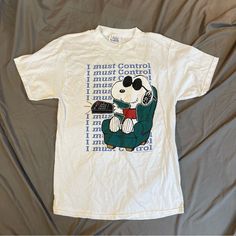 Vintage 90's Nos Deadstock Peanuts Snoopy Joe Cool I Must Control Tv Remote Tee Large Awesome Deadstock Snoopy Joe Cool Shirt Made In The Usa Wide Crew Neck Nwot Excellent Condition 100% Cotton Flat Lay Measurements: Chest 21” Length 30.5” Peanuts Shirts, Snoopy Joe Cool, Joe Cool, Peanuts Snoopy, Tv Remote, Flat Lay, Cool Shirts, Gender Neutral, Snoopy