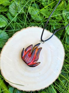 Ignite your style with our exquisite wood-carved flame pendant, a symbol of passion and energy. Meticulously crafted from fine wood, each pendant boasts intricate detailing, capturing the essence of flickering flames. Add a touch of warmth and vibrancy to your look with this striking piece of wearable art. Flame Jewelry, Flame Necklace, Fire Pendant, Fire Necklace, Wood Carved, Wearable Art, Pendant Necklaces, Wood Crafts, Necklace Etsy