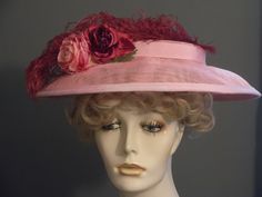 Handmade pink sinamay flat top hat, with large burgundy ostrich feather. Wired brim to hold shape. Pink grosgrain ribbon band encircles flat crown, and matching trim on brim. Three flowers in shades if pink, burgundy and a touch of green are the focal point. Millinery elastic attached to secure hat to head (worn under back of hair at nape of neck). I can add a metal Alice band instead if desired. Perfect derby hat, or garden party. Fits all head sizes. Pink Feather Trim Mini Hat For Evening, Pink Mini Hat With Feather Trim For Evening, Fitted Pink Mini Hat With Feather Trim, Fitted Pink Fascinator With Feather Trim, Pink Mini Hat With Feather Trim For Summer, Pink Feather Trim Hat For Evening, Pink Feather Trim Hat For Summer, Pink Evening Hat With Feather Trim, Fitted Hats With Feather Trim For Races