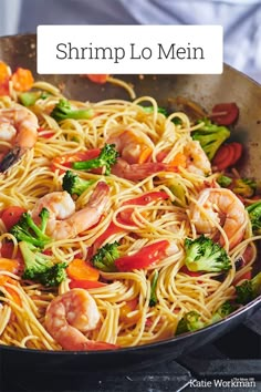 shrimp lo mein in a skillet with broccoli and peppers