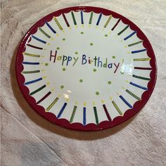 a happy birthday plate with candles on it