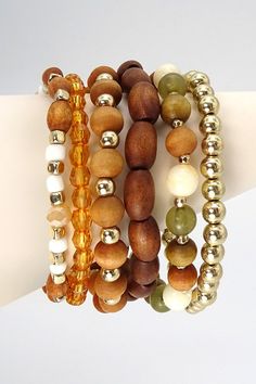 Exude bohemian flair when you wear this wooden bead stretch bracelet set. DIMENSION clasp: Stretchable metal finish: Gold Plating product: Lead & Nickle Compliant anti-tarnish: Double E-coating Bohemian Wood Beaded Bracelets, Bohemian Wooden Bead Bracelets, Bohemian Gold Stretch Bracelet With Wooden Beads, Trendy Brown Beaded Bracelets, Bohemian Adjustable Wooden Beaded Bracelets, Adjustable Wooden Bohemian Beaded Bracelets, Adjustable Bohemian Wood Jewelry, Wood Bead Bracelet, Gold Bracelet Set