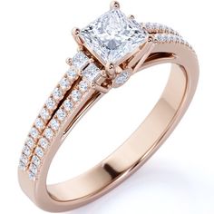 a rose gold engagement ring with two princess cut diamonds on the shoulders and side stones