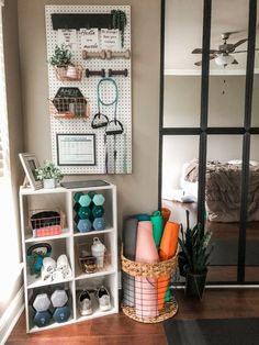 a living room filled with lots of furniture and decor on top of a hard wood floor