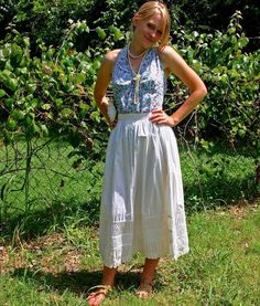 Offering this beautiful vintage white cotton skirt from the 70s.  It is Edwardian style.  Above the hem are rows of shirring between a row of pintuck.  The hem is trimmed in a ruffle.  The skirt buttons in the back.  This skirt is in great vintage condition without stains or tears.  Waist = 26"Length = 33" Peasant Cotton Skirt With Ruffles, Cottagecore White Cotton Skirt, White Cotton Cottagecore Skirt, Peasant Cotton Skirt For Spring, White Cotton Skirt For Garden Party, Cotton Peasant Skirt For Spring, Spring Cotton Peasant Skirt, Vintage Ruffled Skirt For Spring, White Vintage Gathered Skirt