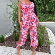 Nwt Imported From Europe Jumpsuits Are Without A Doubt, A Statement Style. The Head-To-Toe, All-In-One Garment Creates A Striking Look. Be A Picture Of Perfection Wearing This Floral Jumpsuit Featuring Split Side. Add Strappy Heels And Statement Earrings For A Pretty Look! Strappy Jumpsuit Floral Print Split Side Regular Fit Model Is 5ft 7" & Wears Us Size 4 Uk Size 8 Eu Size 38 Aus Size 8 100% Polyester Machine Washable Pink Sleeveless Jumpsuits And Rompers For Summer, Fitted Pink Jumpsuits And Rompers, Pink Sleeveless Summer Jumpsuits And Rompers, Pink Sleeveless Summer Jumpsuit, Trendy Pink Sleeveless Jumpsuits And Rompers, Pink Printed V-neck Jumpsuits And Rompers, Summer Pink Floral Print Jumpsuits And Rompers, Summer Pink Floral Jumpsuits And Rompers, Pink Summer Vacation Jumpsuits And Rompers