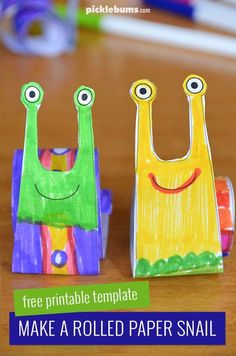 two colorful paper snails with the title free printable template make a rolled paper snail