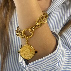 Large coin bracelet large size steel chains and closure bracelet . it is decorated with an oversized coin made of gold plated 24 k zamac .  coin can be removed and bracelet can be worn also as plane chains Bracelet or you can add more charms in it .  it is available in various sizes .  18cm equals 7 inches ( small )  19 cm equals 7.48 inches  ( regular choice )  20 cm  equals 7.87 inches ( regular loose )  21 cm equals 8.26 inches  ( large )  22 cm equals 8.66 inches  ( xl ) 💙in my collection y Coin Charm Bracelet, Double Chain Bracelet, Coin Bracelet, Double Chain, Coin Jewelry, Matching Necklaces, Steel Chain, Charm Bracelets, Chain Bracelet