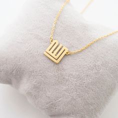 This necklace is a piece of our new collection of Allah necklace made from sterling silver and 14k gold. The collection includes different designs that suit all tastes Kufi/calligraphy, heart/rectangle/triangle shapes, tiny/big sizes. Here is the link for the full collection: https://etsy.me/2Swd0lPAll the designs can be made as necklace, bracelet, and earrings. If you also want a complete set that includes a necklace, a bracelet and earrings please get in touch with us. We accept custom orders! Gold Sterling Silver Charm Necklace For Mom, Silver Square Pendant Necklace In 14k Gold, Fine Jewelry Square Pendant Necklace For Gift, Silver 14k Gold Square Pendant Necklace, 14k Gold Square Pendant Necklace For Gift, Minimalist 14k Gold Necklace For Mom, Gold Sterling Silver Necklace As Gift For Mom, Gold Sterling Silver Initial Necklace For Her, Gold 14k Necklace As Gift For Mom